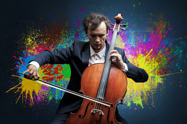 Young classical musician with colorful splotch wallpaper